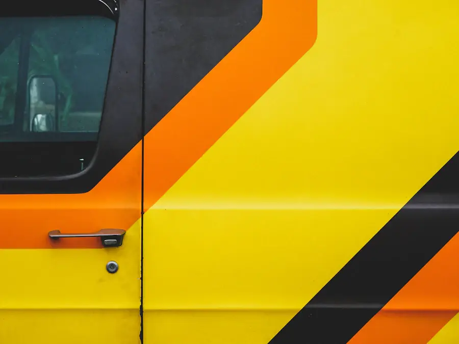 Yellow van door with black and orange chevron livery